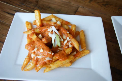 Crispy French Fries with Butter Chicken Poutine - Bombay Grill Milton